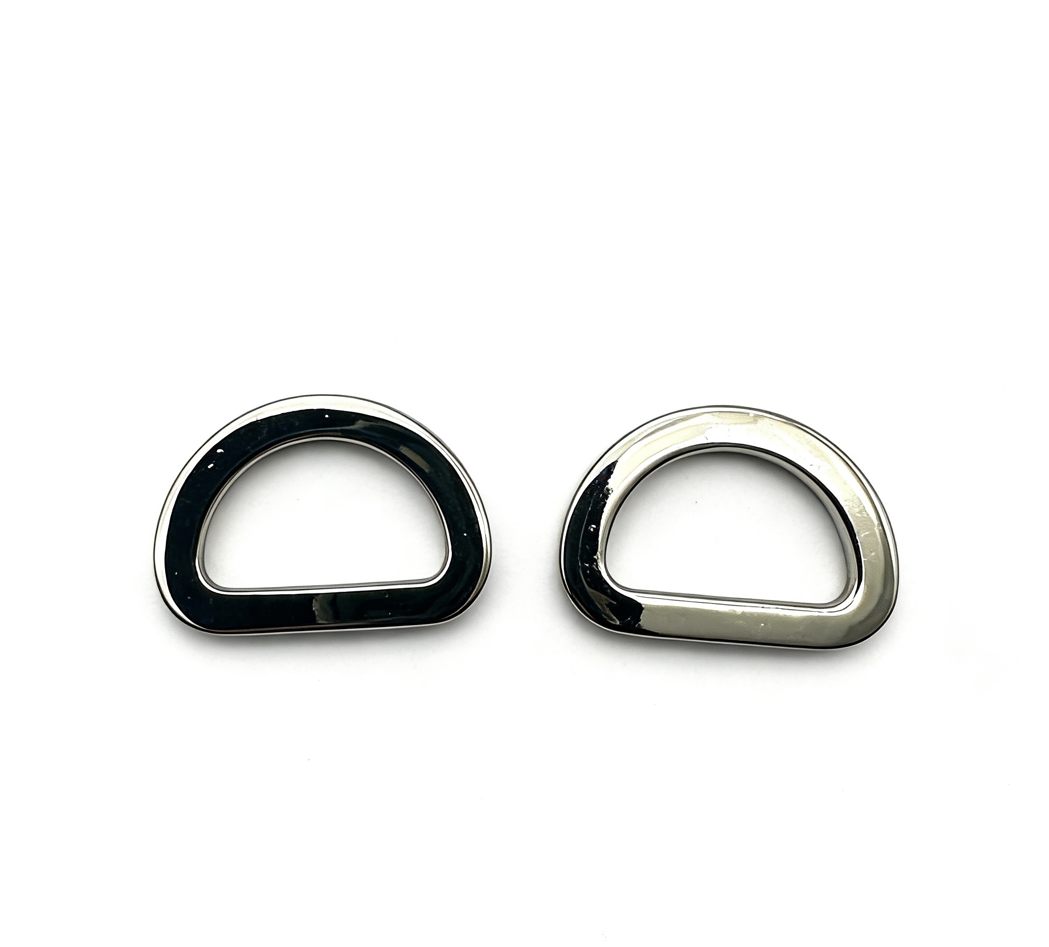 High-end glossy black and mirror-polished silver solid D-rings for luxury leather bags and modern accessories, custom OEM manufactured by Wahkoi Metal.