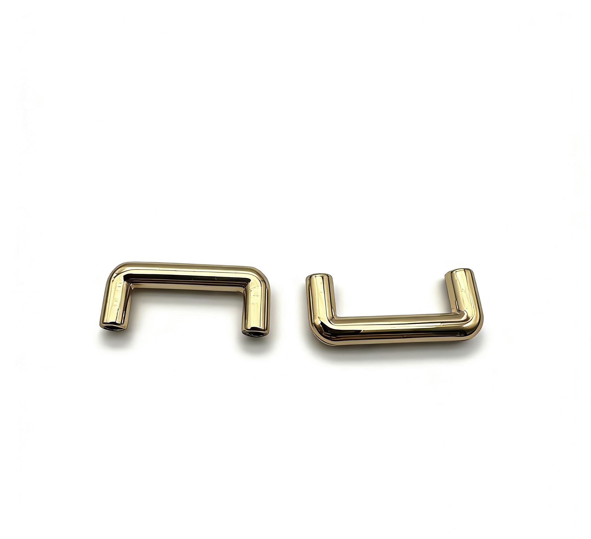High-end mirror-polished light gold arched bridge connector and strap anchor for luxury handbags, custom OEM manufactured by Wahkoi Metal.