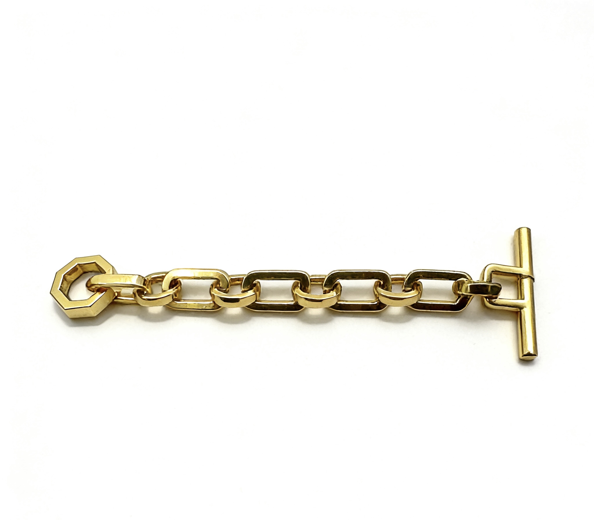 High-end mirror-polished light gold T-bar toggle clasp with hexagon ring and chunky chain for luxury handbag closures and jewelry, custom OEM manufactured by Wahkoi Metal.
