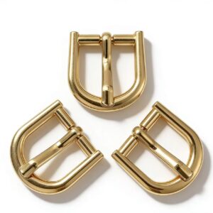High-end mirror-polished light gold horseshoe pin buckle and U-shaped strap adjuster for luxury leather bags and belts, custom OEM manufactured by Wahkoi Metal.