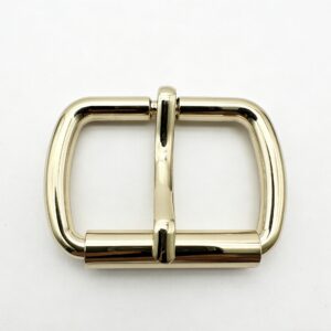 High-end mirror-polished light gold softly rounded tubular roller pin buckle and strap adjuster for luxury leather bags and belts, custom OEM manufactured by Wahkoi Metal.