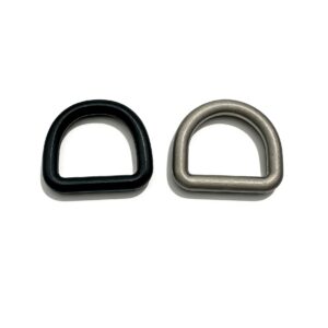 High-end solid D-rings featuring tactical matte black and heritage antique silver finishes for premium leathercraft and techwear, custom OEM manufactured by Wahkoi Metal.