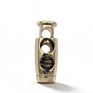 High-end mirror-polished light gold metal cord lock and spring toggle stopper for luxury bucket bags and outerwear, custom OEM manufactured by Wahkoi Metal.