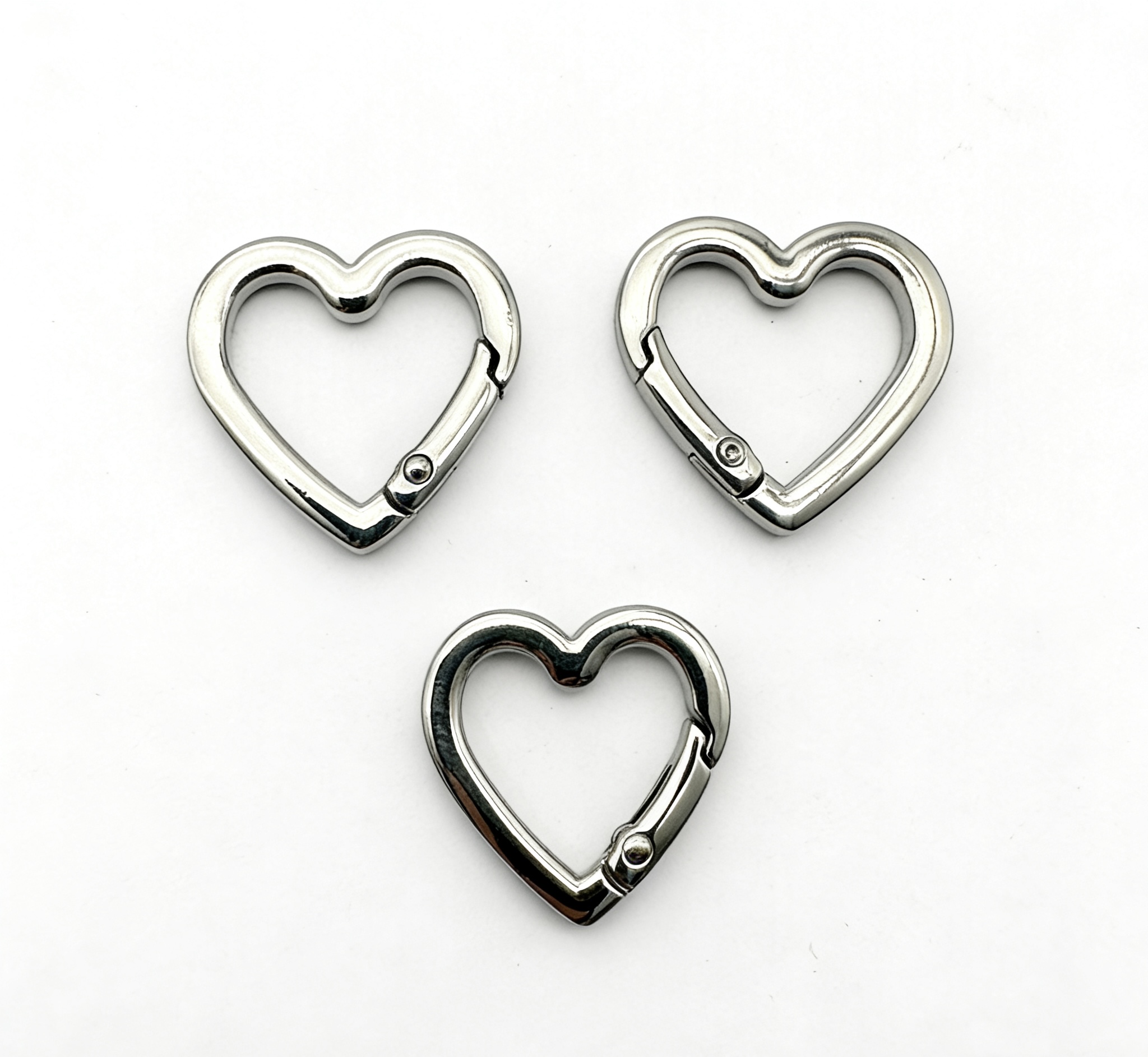 High-end mirror-polished silver heart-shaped spring gate ring and openable carabiner for luxury bags and trendy charms, custom OEM manufactured by Wahkoi Metal.