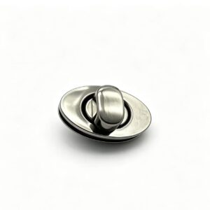 Premium brushed silver zinc alloy oval turn lock for luxury handbags, custom manufactured by Wahkoi Metal.