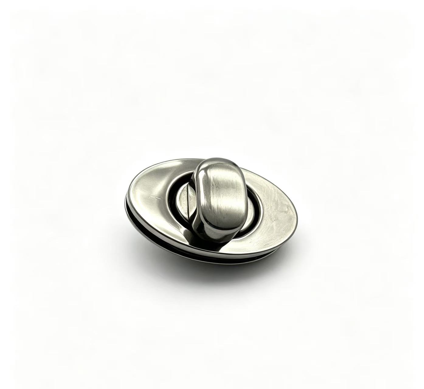 Premium brushed silver zinc alloy oval turn lock for luxury handbags, custom manufactured by Wahkoi Metal.