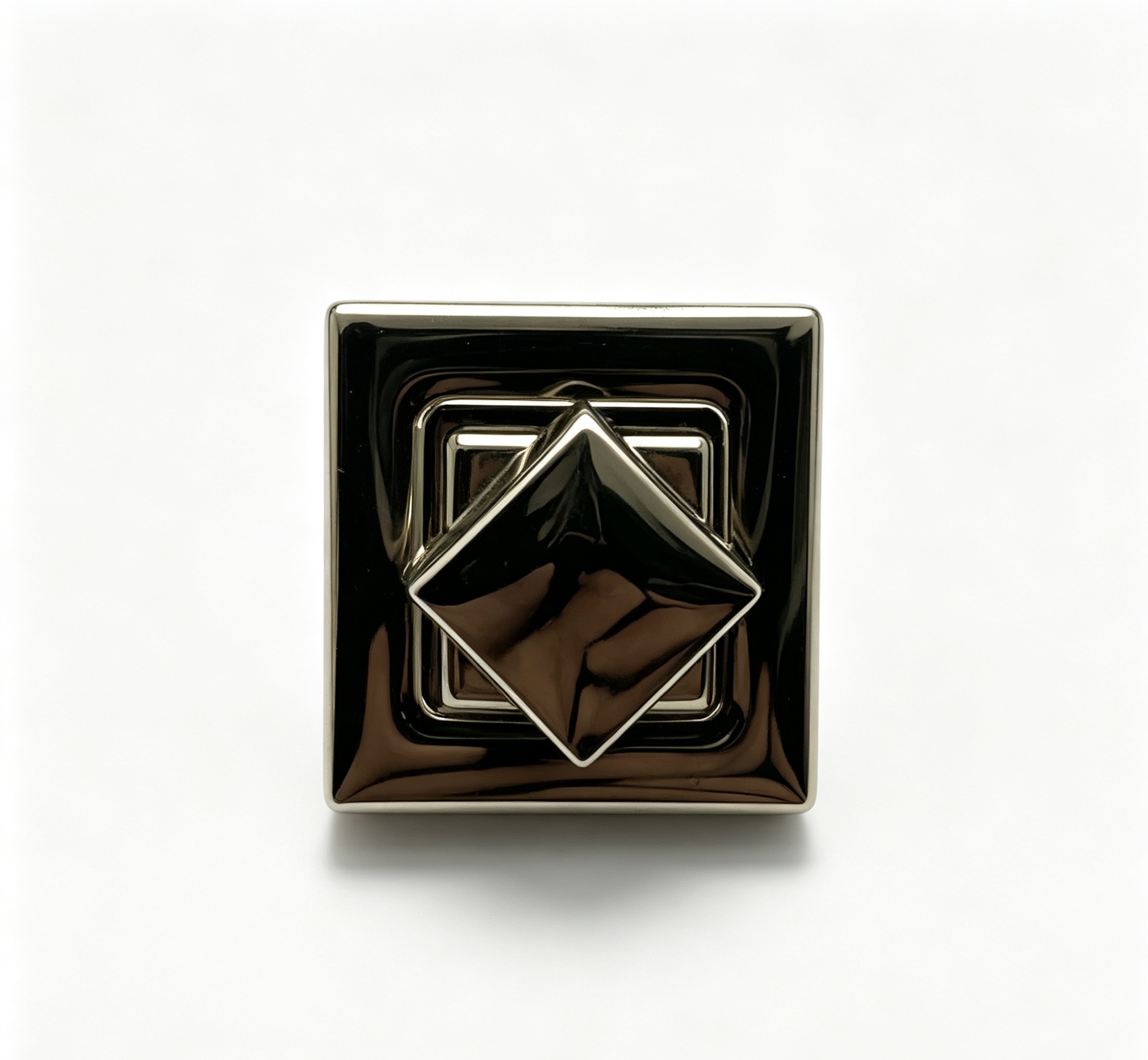 Close-up of a high-polish gunmetal square twist lock with a 3D diamond-faceted turn mechanism for luxury handbags, custom manufactured by Wahkoi Metal