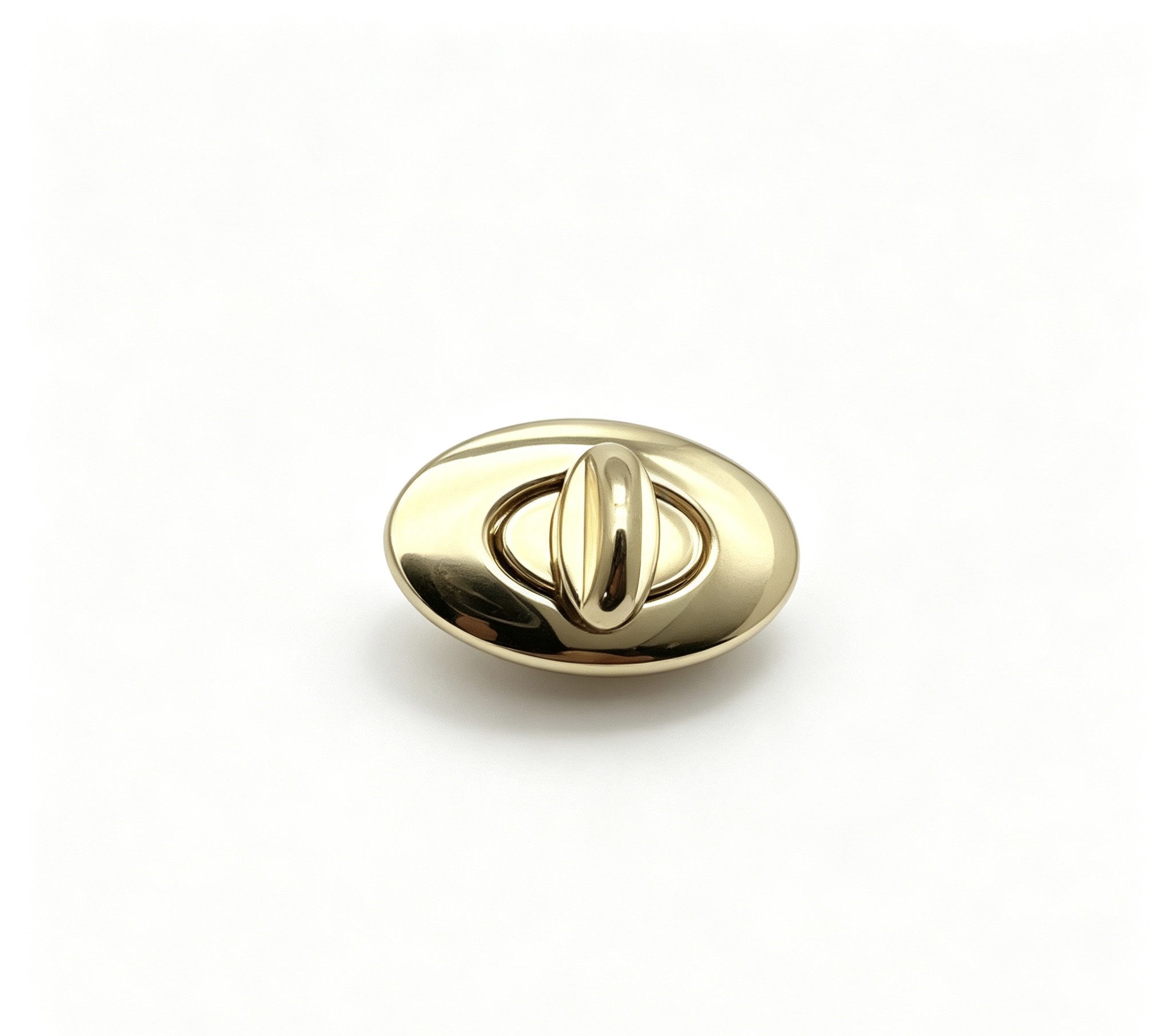 Close-up of a high-polish light gold oval twist lock hardware for luxury handbags manufactured by Wahkoi Metal