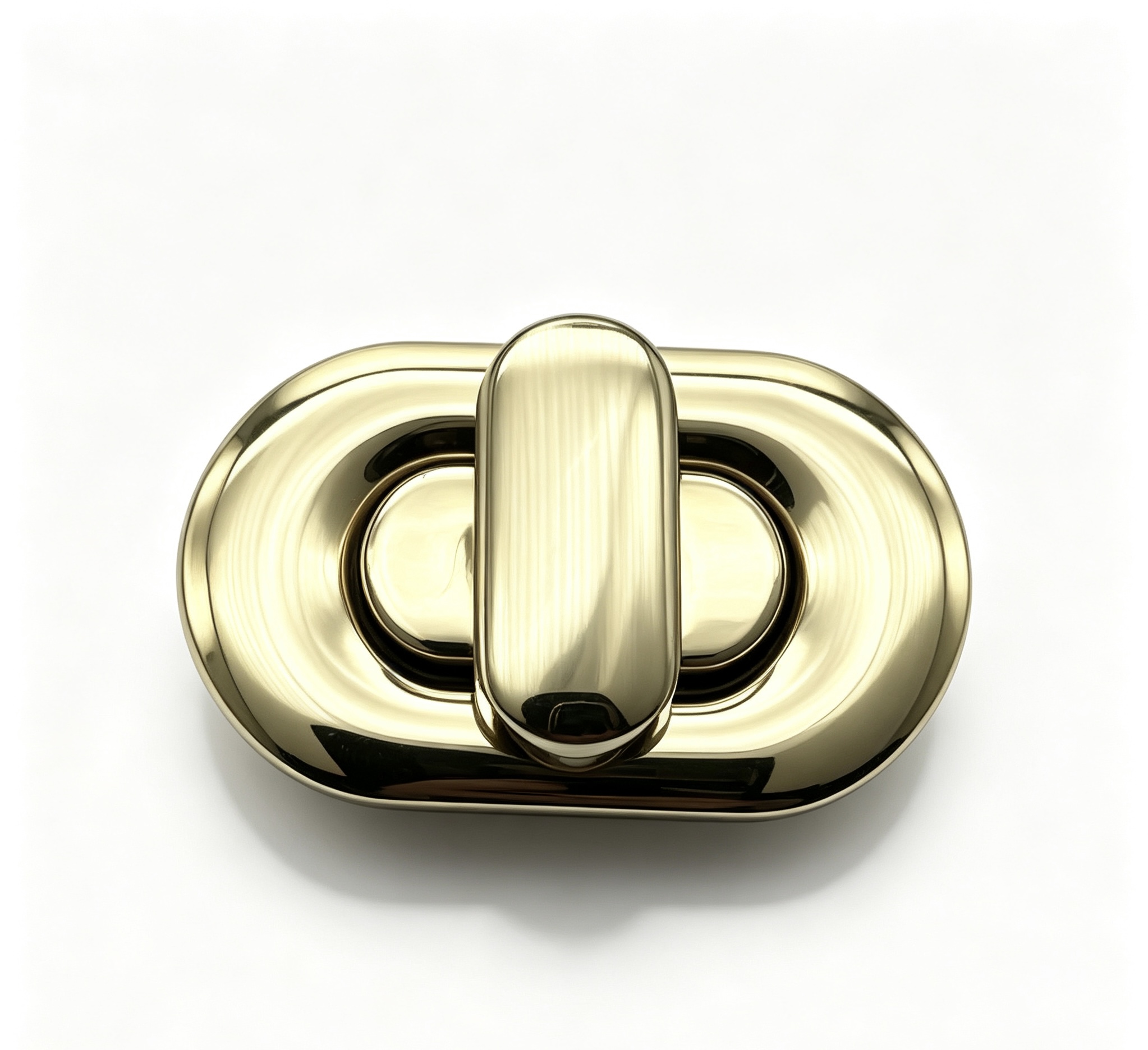Close-up of a high-polish light gold pill-shaped capsule twist lock for luxury puffy handbags, custom manufactured by Wahkoi Metal