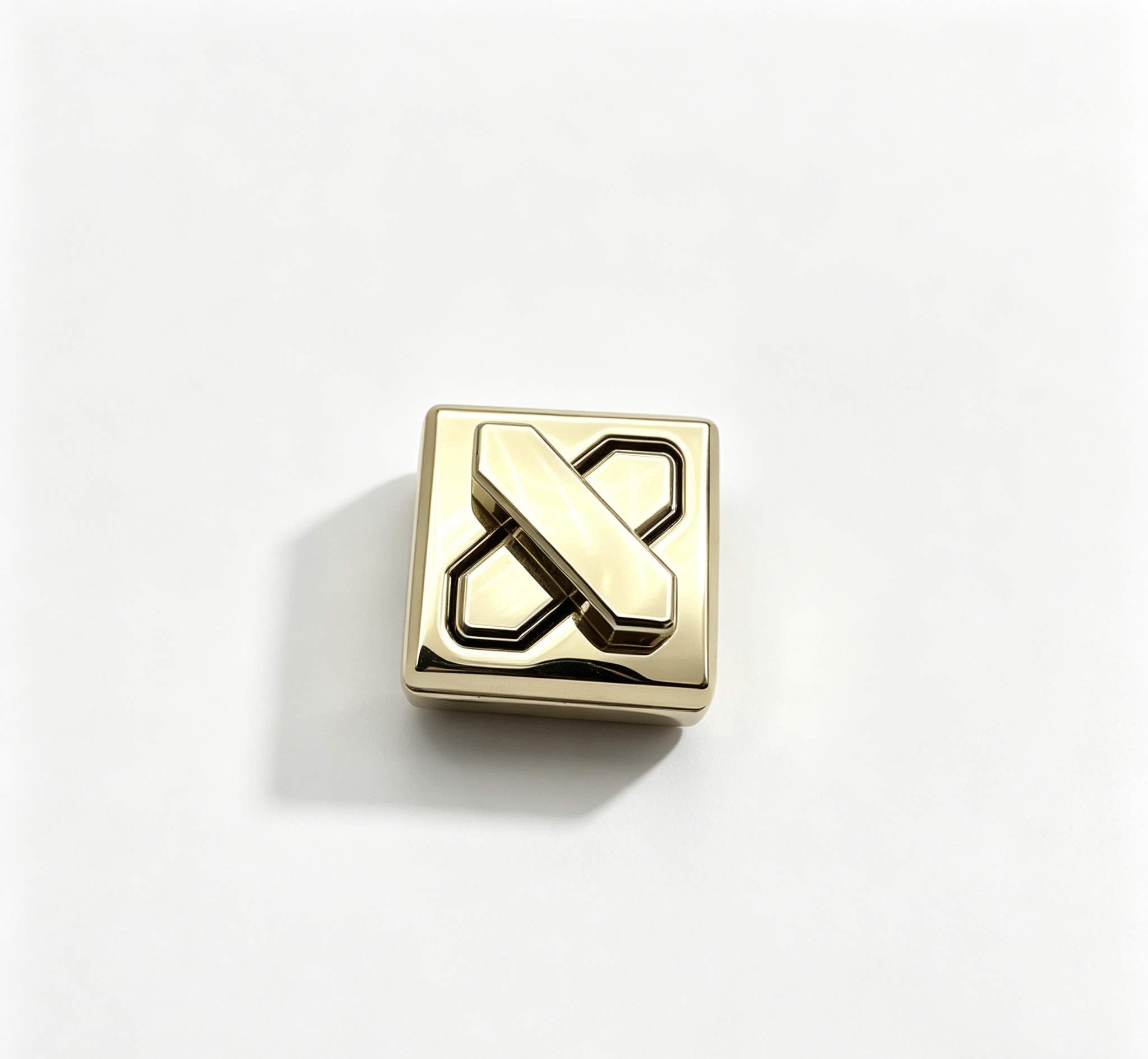 Close-up of a high-polish light gold square twist lock featuring a geometric X-shape turn mechanism for luxury handbags, manufactured by Wahkoi Metal