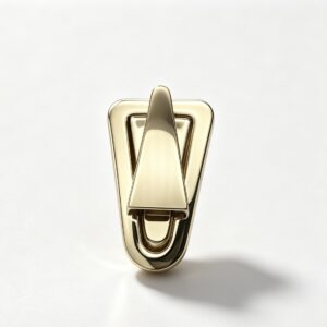 Close-up of a high-polish light gold triangle shield twist lock featuring a modern geometric design for luxury handbags, custom manufactured by Wahkoi Metal