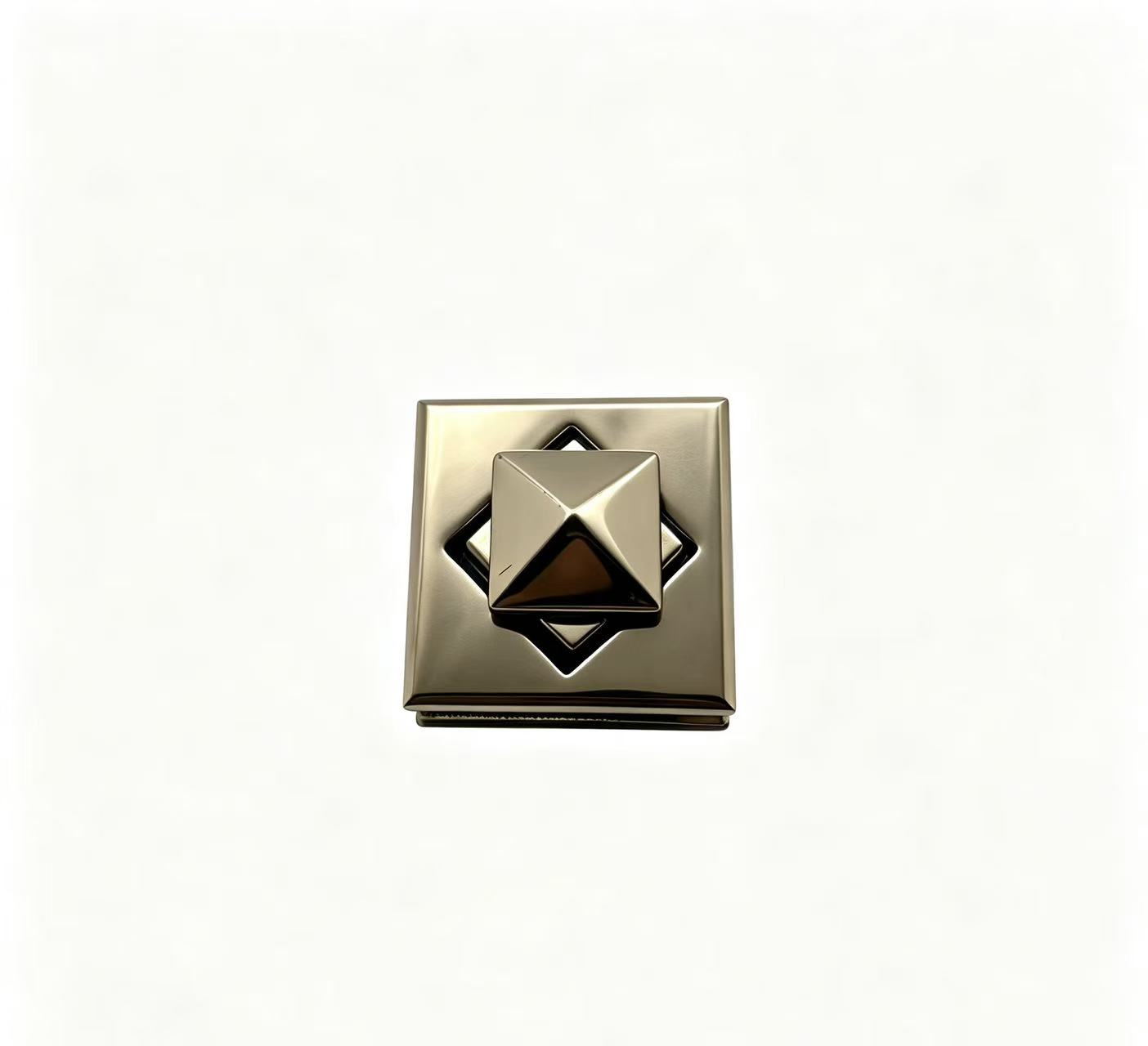 Premium polished light gold zinc alloy square turn lock with pyramid twist knob and geometric diamond cutout for luxury handbags, custom manufactured by Wahkoi Metal.