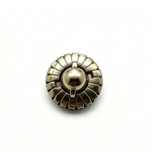 Premium light gold zinc alloy round turn lock with sunburst fluted edge and dome knob for luxury handbags, custom manufactured by Wahkoi Metal.